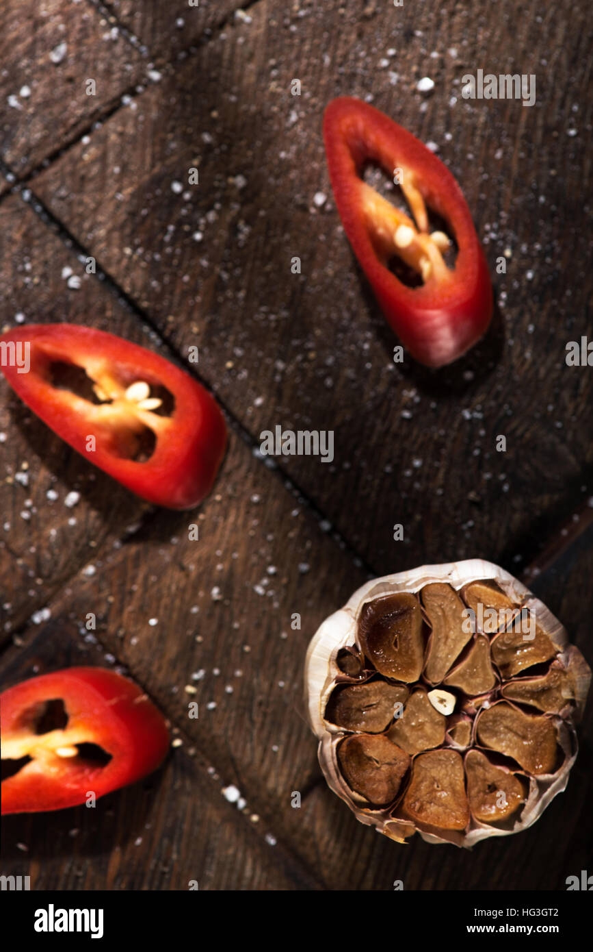 Top view of garlic and pepper lying on a table Stock Photo - Alamy