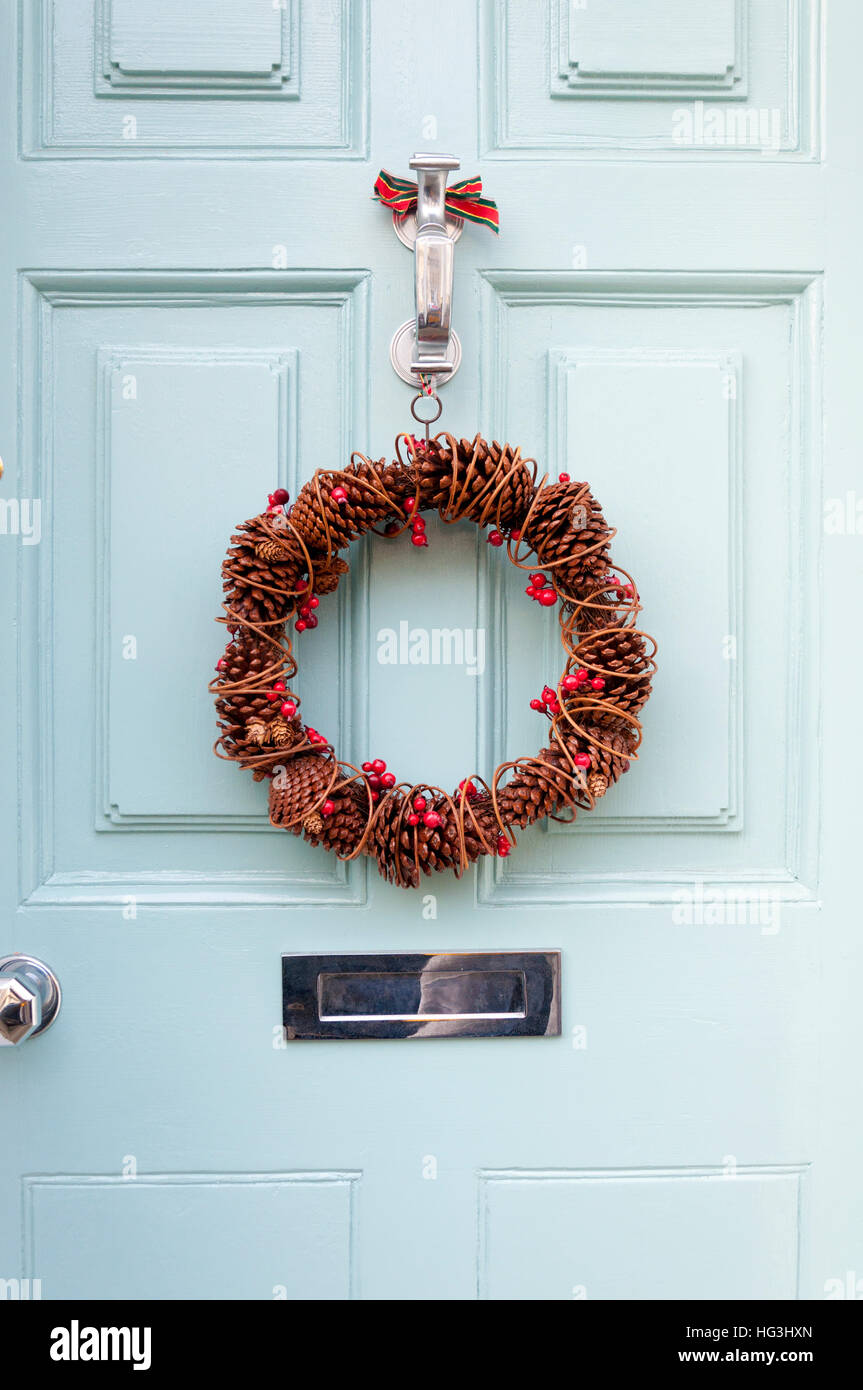Christmas wreath on front door hanging Stock Photo