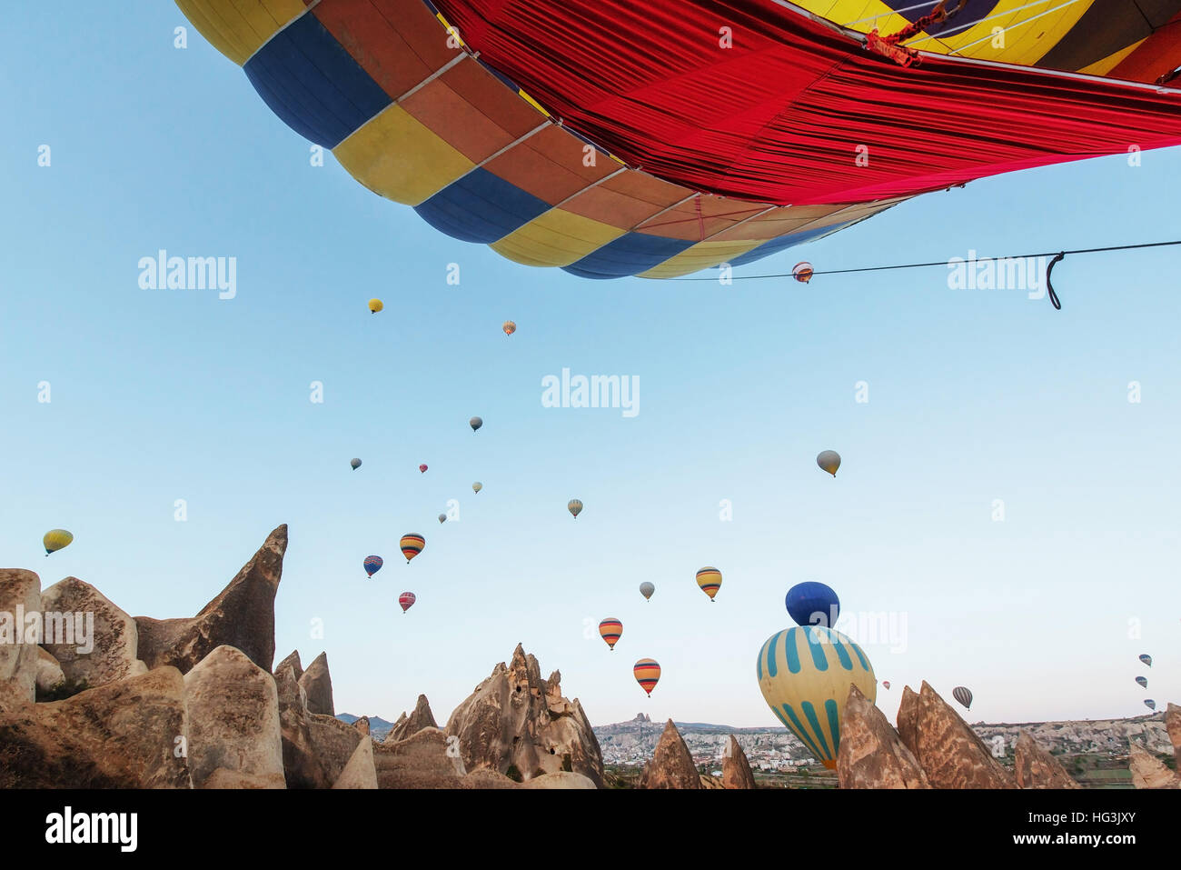 Hot air balloon flying over rock landscape at Turkey. Cappadocia Stock ...