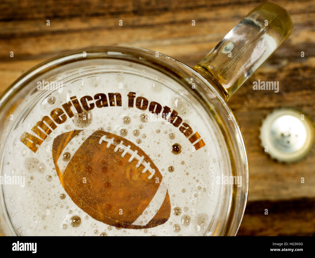 Football in foam of a fresh beer Stock Photo