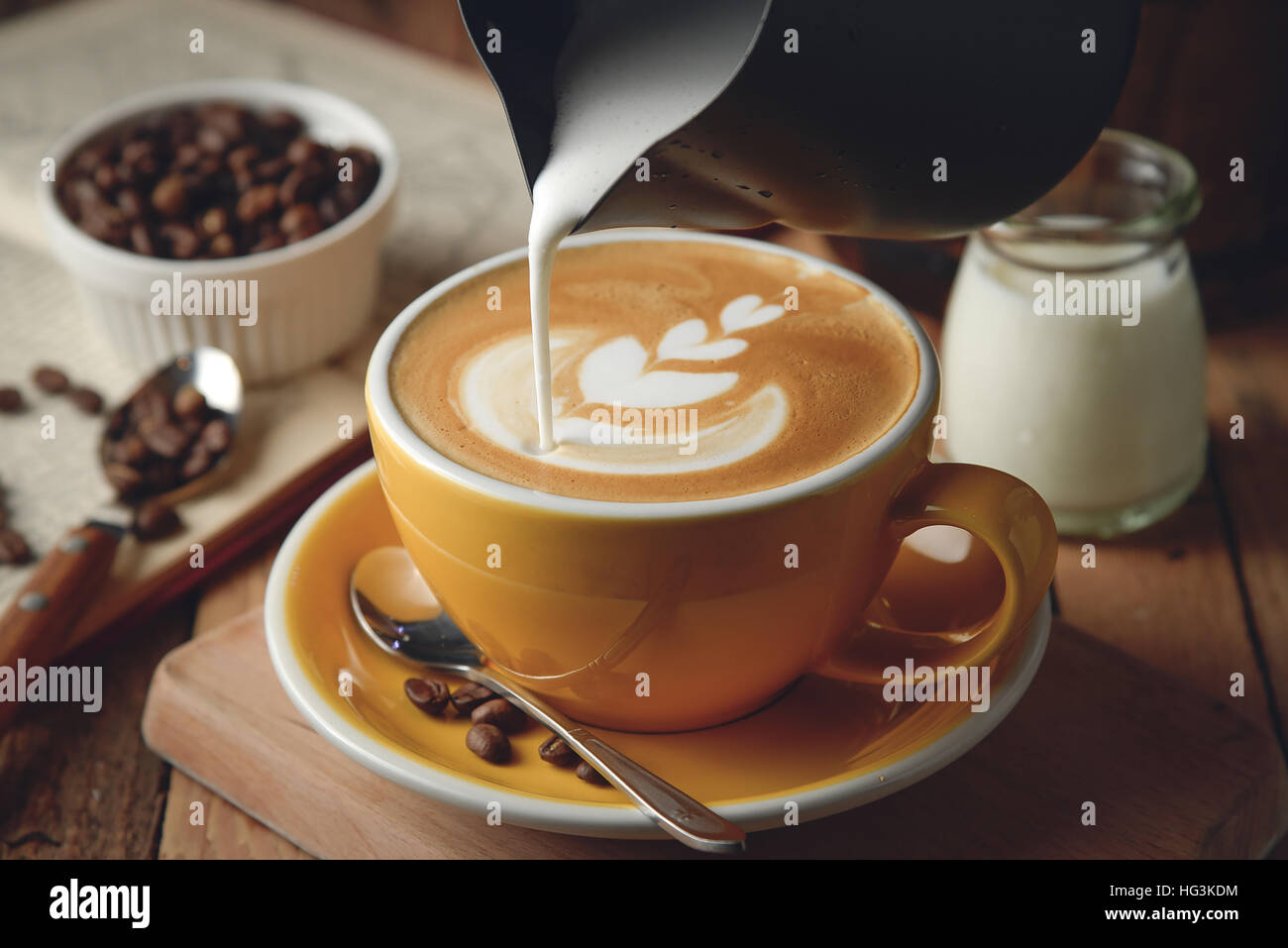 Making latte Art on a Cappuccino. Freshly made Stock Photo Alamy