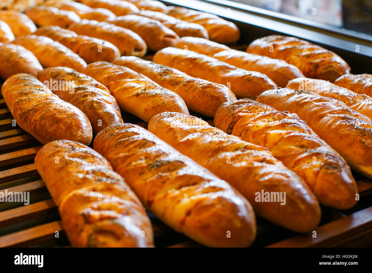 bread baking in oven. Production oven at the bakery. Baking bread. Manufacture of bread. Stock Photo