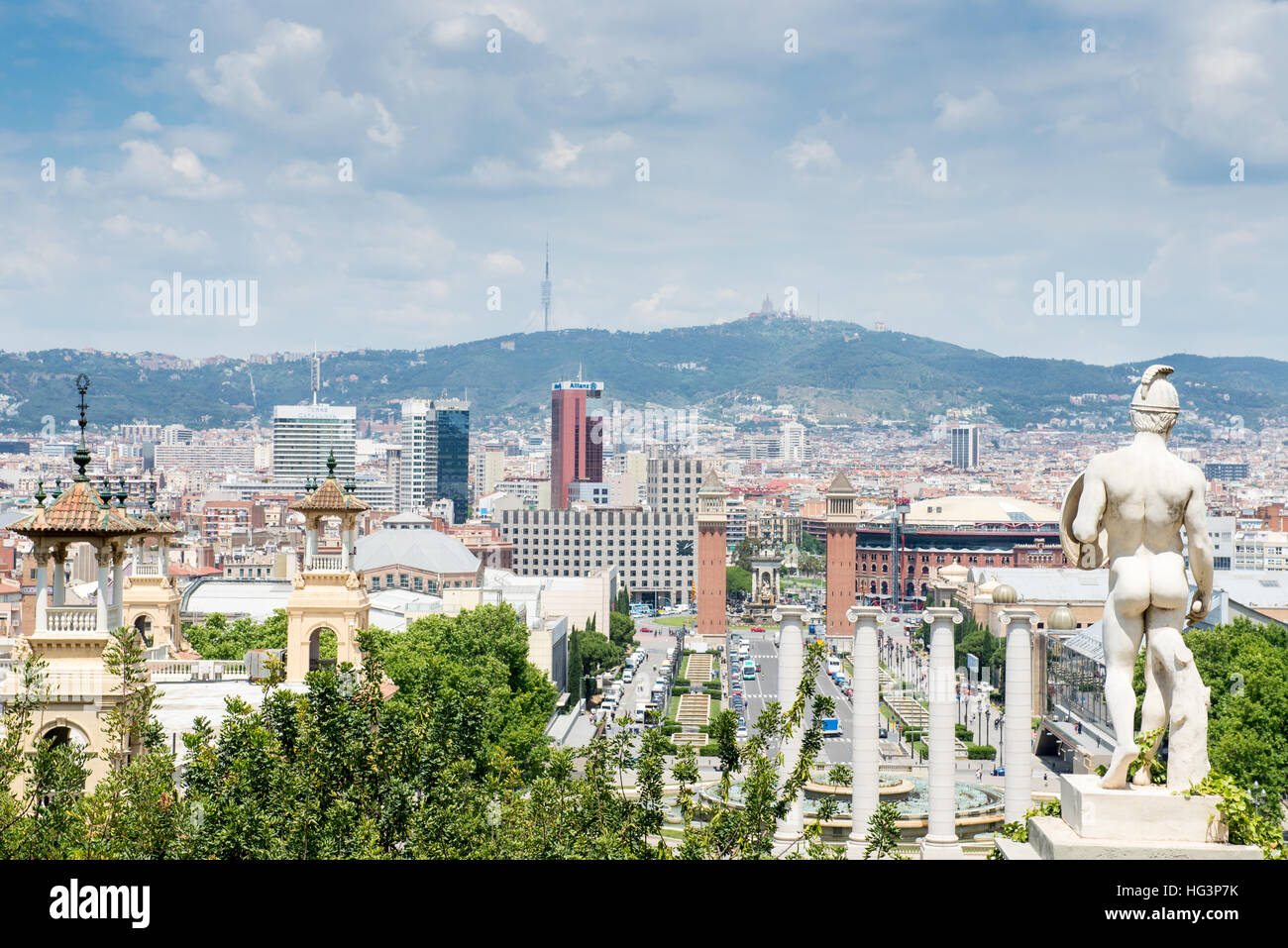 View a statue looking out over the Avenue Reina Maria Cristina, with Halls 1, 2, 5 and 7 of Fira de Barcelona (aka Fira Montjuic, the exhibition centr Stock Photo