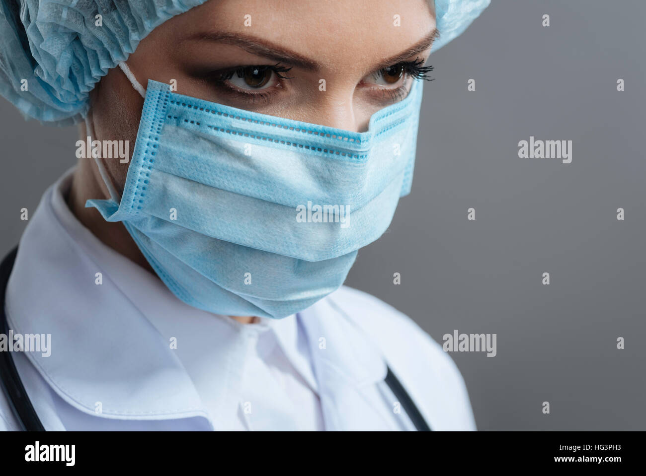 Beautiful woman wearing medical face mask Stock Photo - Alamy