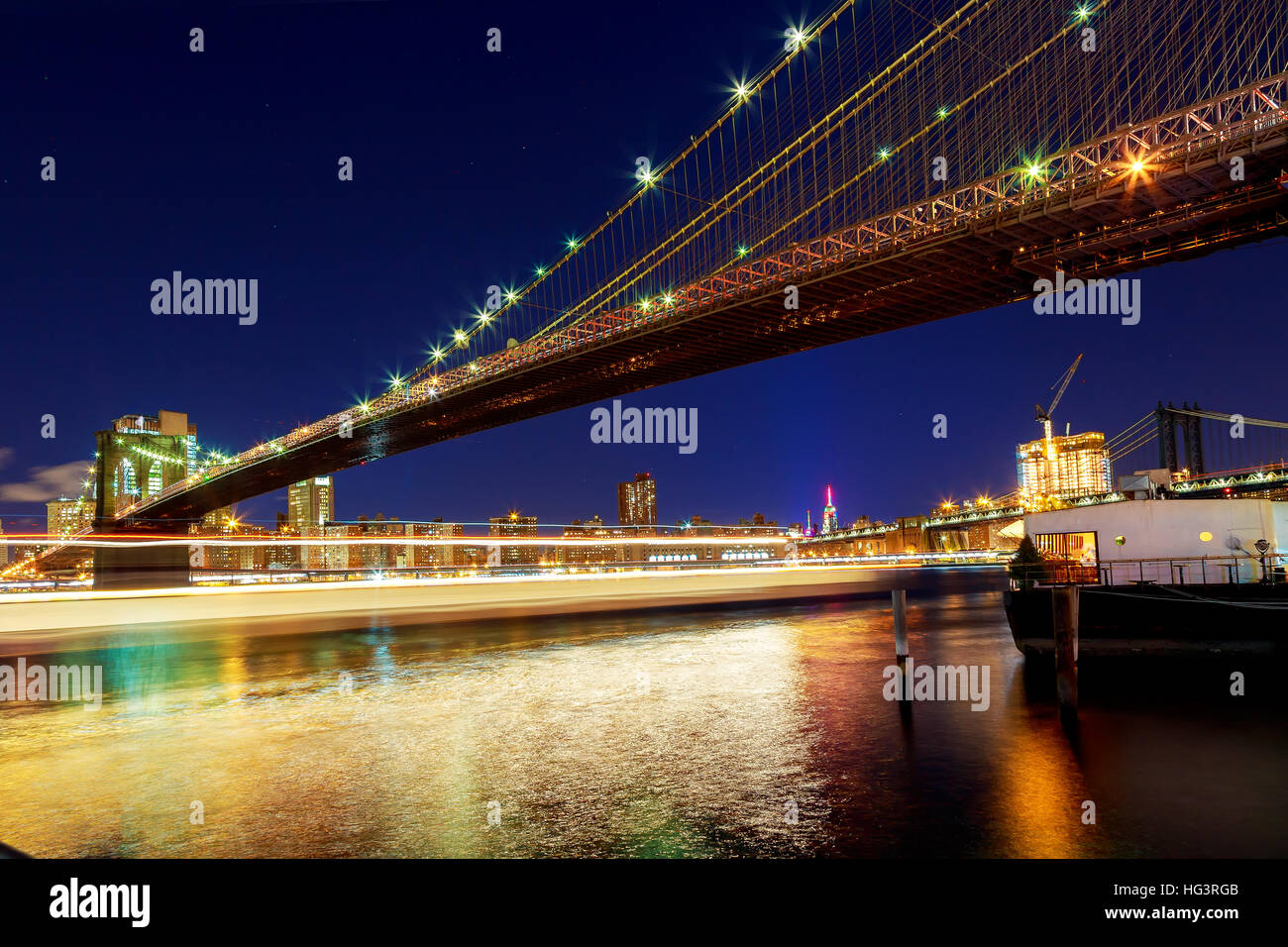 Brooklyn Bridge over East River at night in New York City Manhattan ...