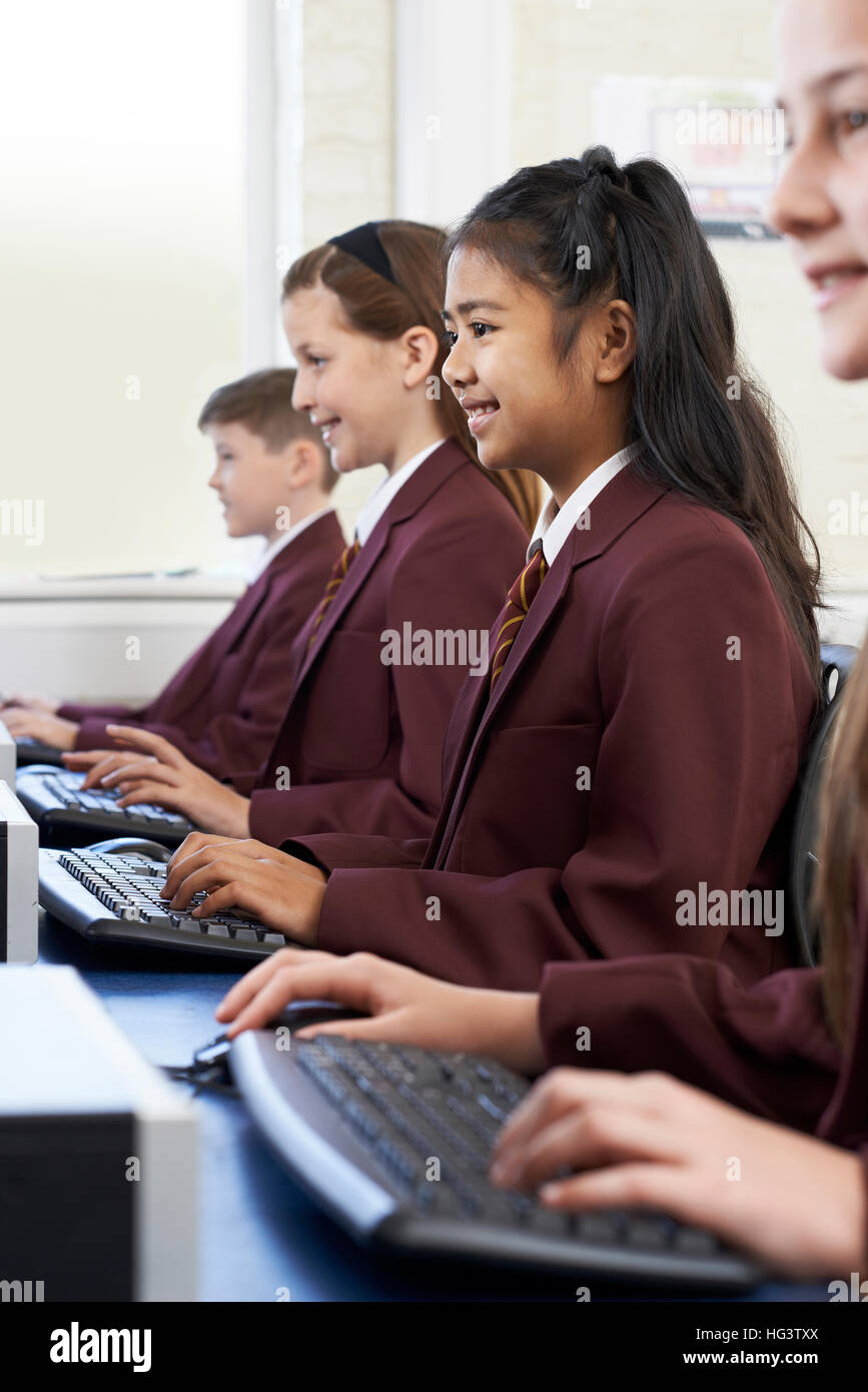 Pupils Wearing School Uniform In Computer Class Stock Photo - Alamy