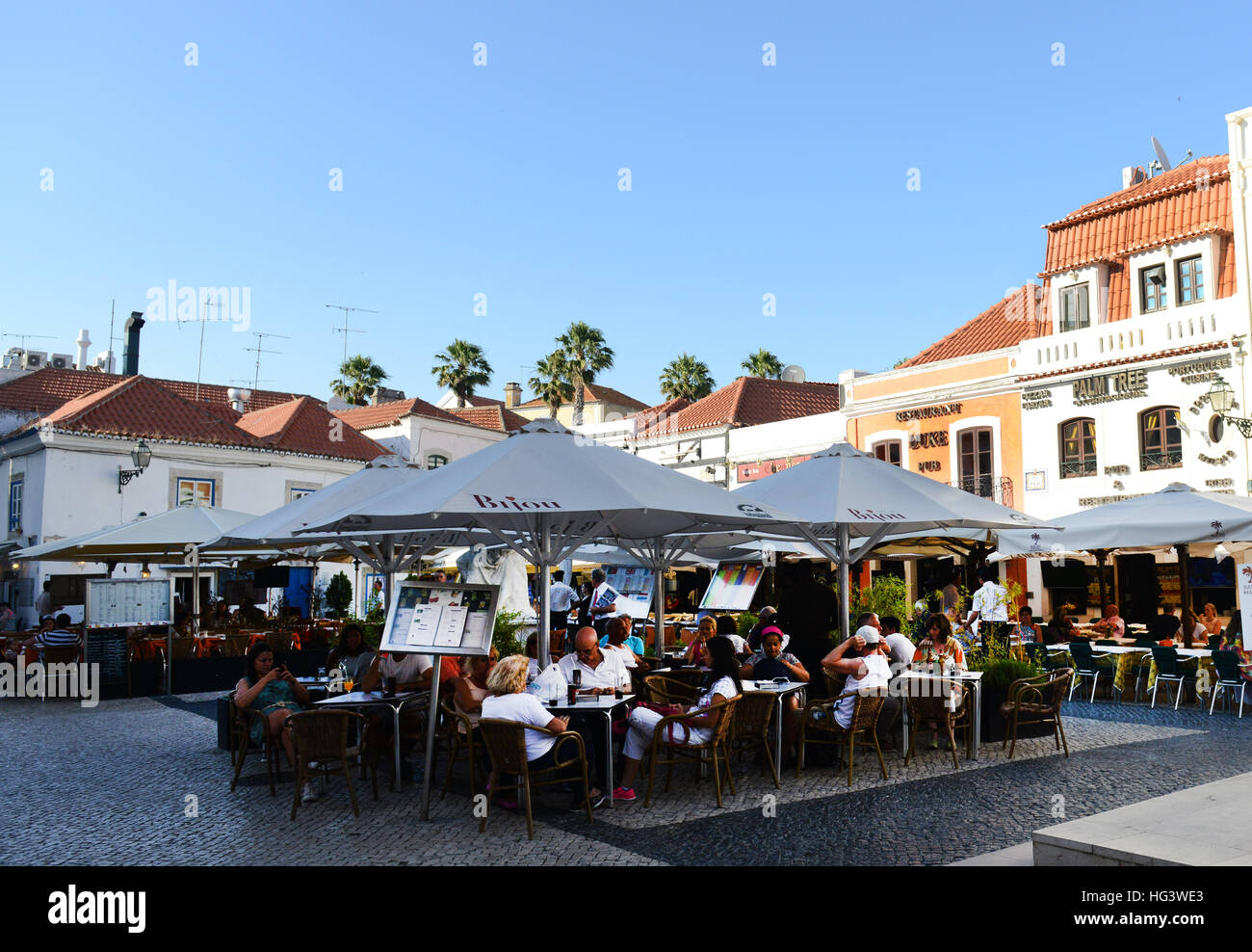 Tourist sitting in an outdoor café / restaurant in Cascais, Portugal. Stock Photo