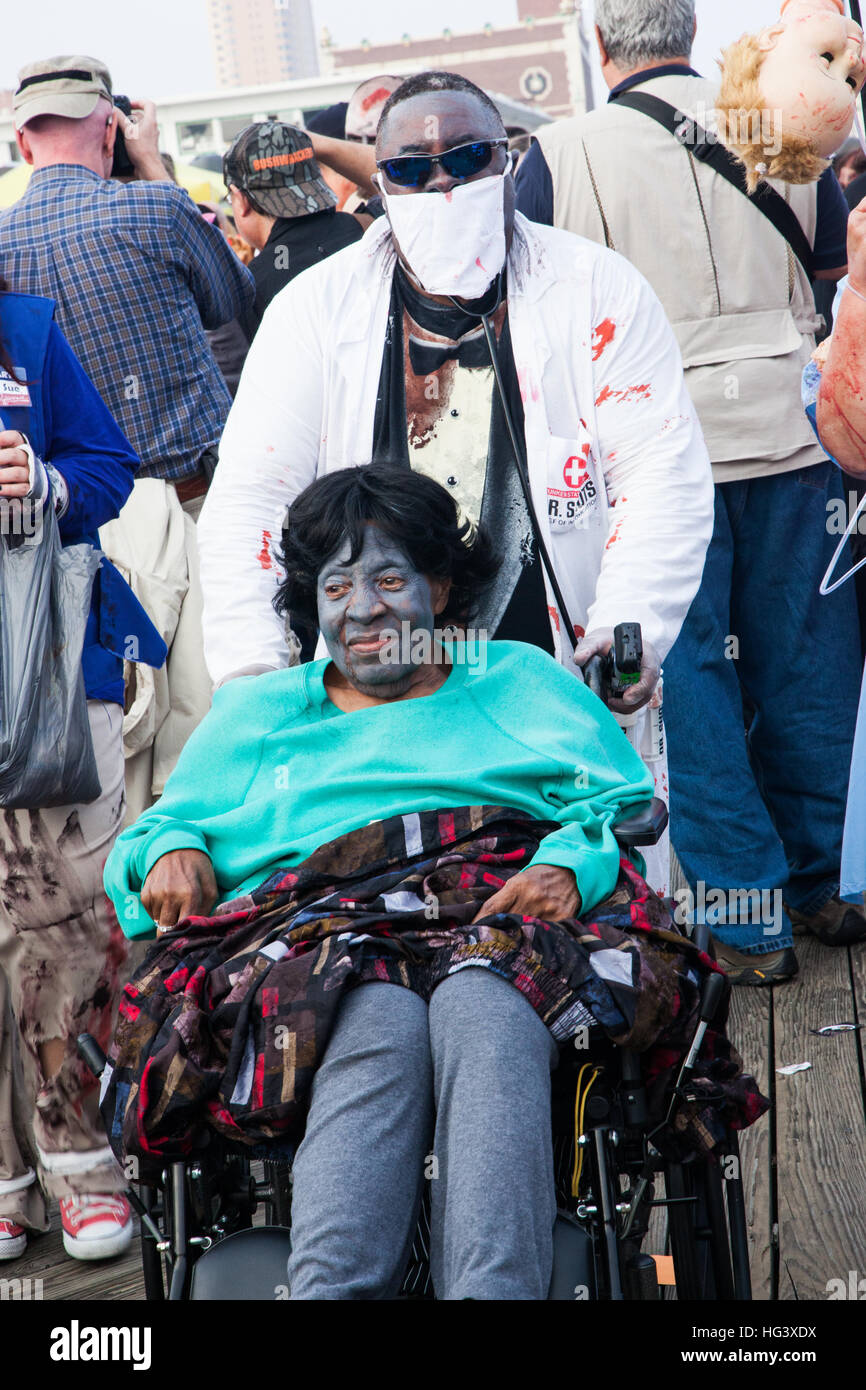 Zombies walk on the boardwalk and through the streets of Asbury Park, NJ during the annual Zombie Walk on October 5, 2013. Stock Photo