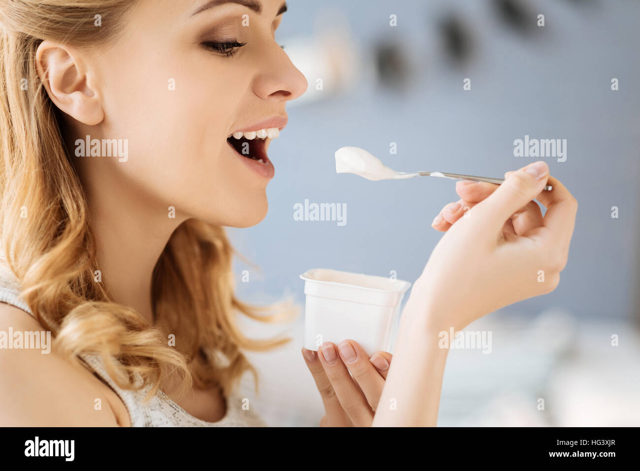 Portrait of pregnant woman eating yoghurt Stock Photo Alamy