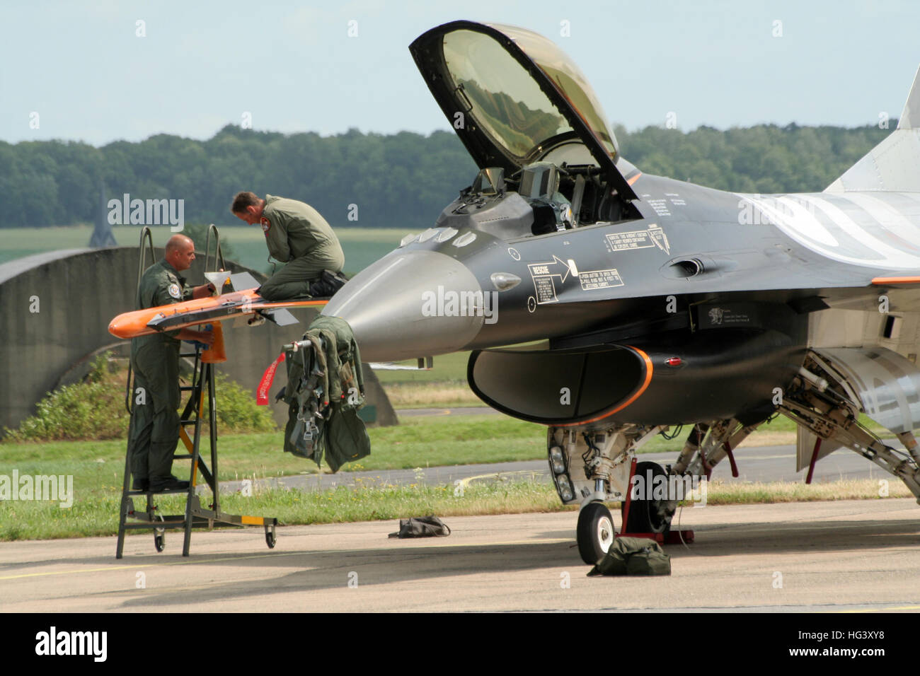 Smoke pods are being filled of a Royal Netherlands Air Force F-16 fighter  jet demonstration plane Stock Photo - Alamy