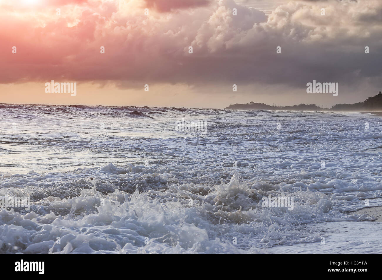Wind, waves and rains sunset Stock Photo - Alamy