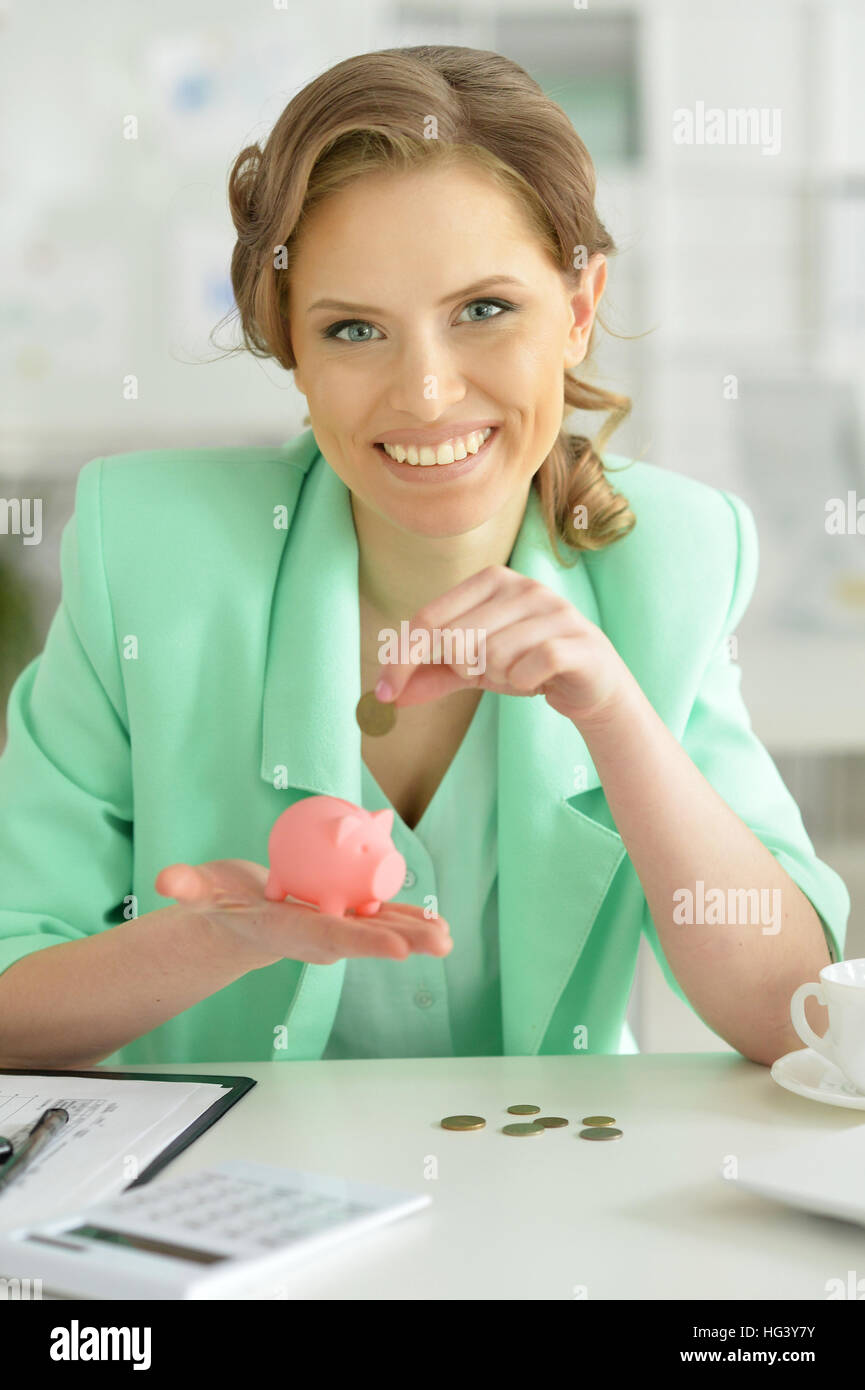 Woman with piggy bank Stock Photo - Alamy