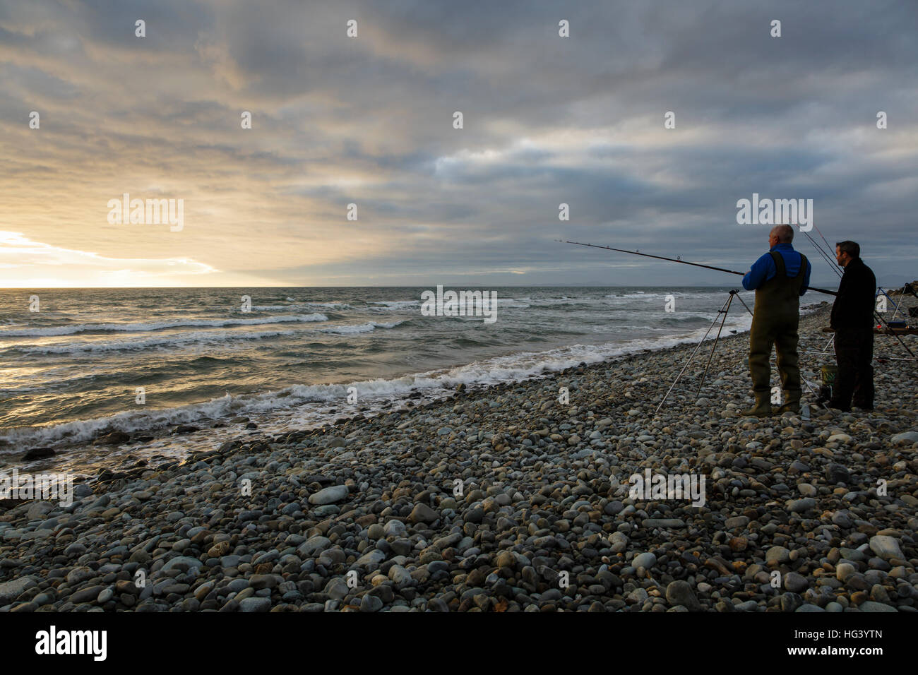 Beach fishing at Talybont, near Barmouth, Gwynedd, Wales Stock Photo