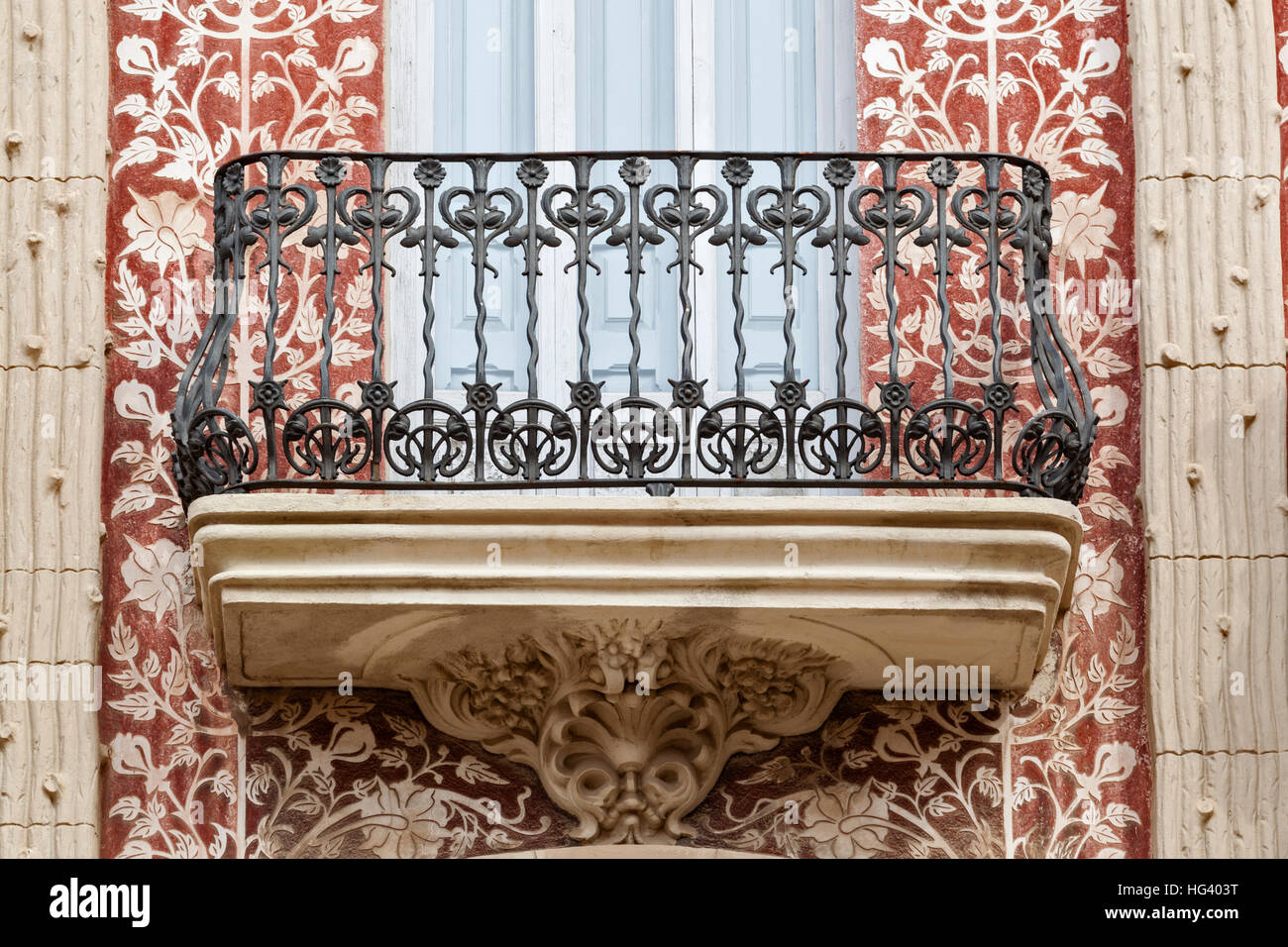 Exterior detail view of wrought iron balcony and modernist ornamentation adorning the Casa del Punt de Gantxo in old town Stock Photo