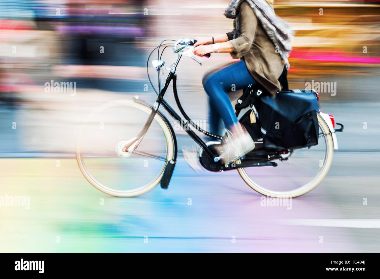 bicycle rider in the city in motion blur Stock Photo - Alamy