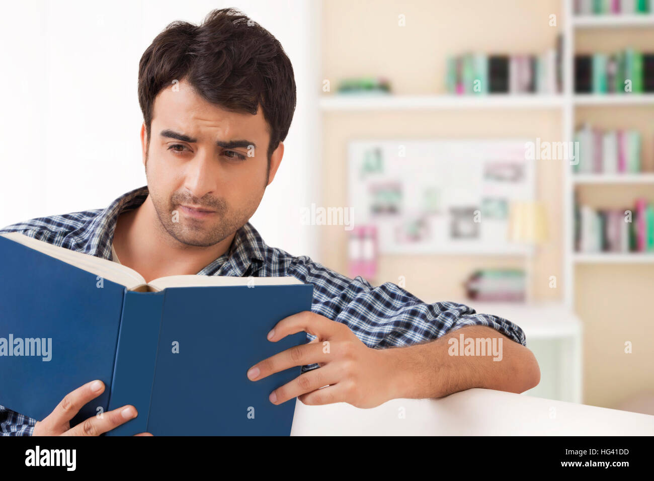 Young man reading book Stock Photo