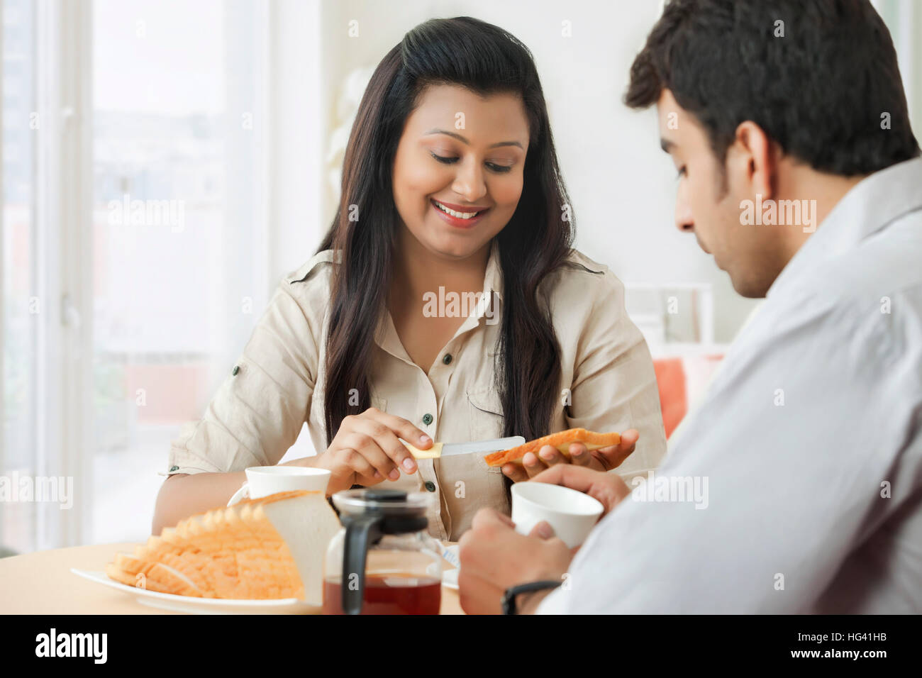 Young couple having breakfast Stock Photo