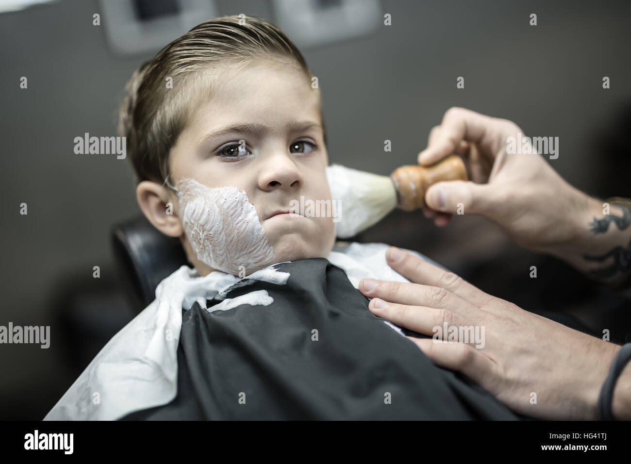 Humorous shaving of little boy Stock Photo Alamy