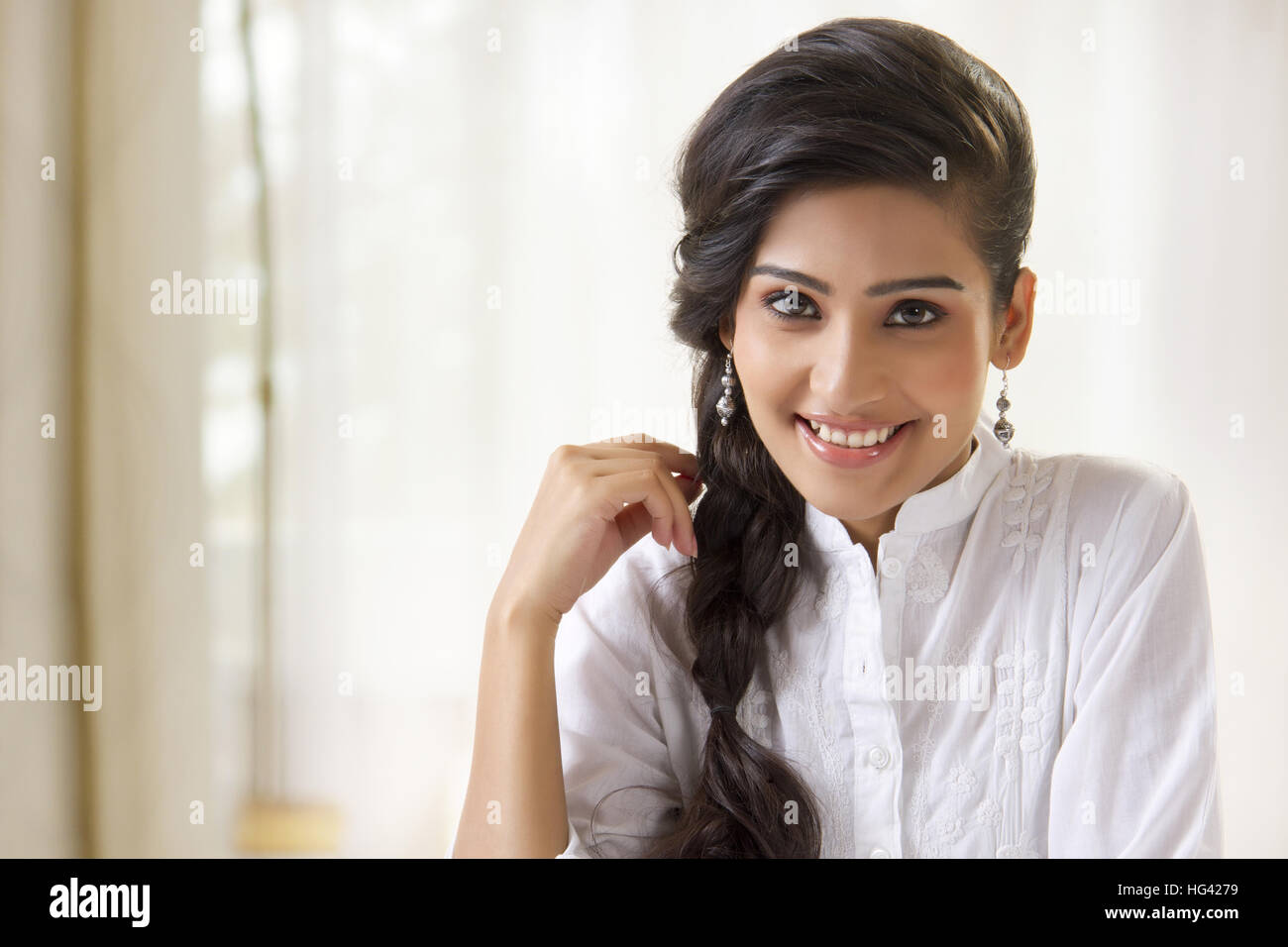 Portrait of beautiful young woman smiling Stock Photo