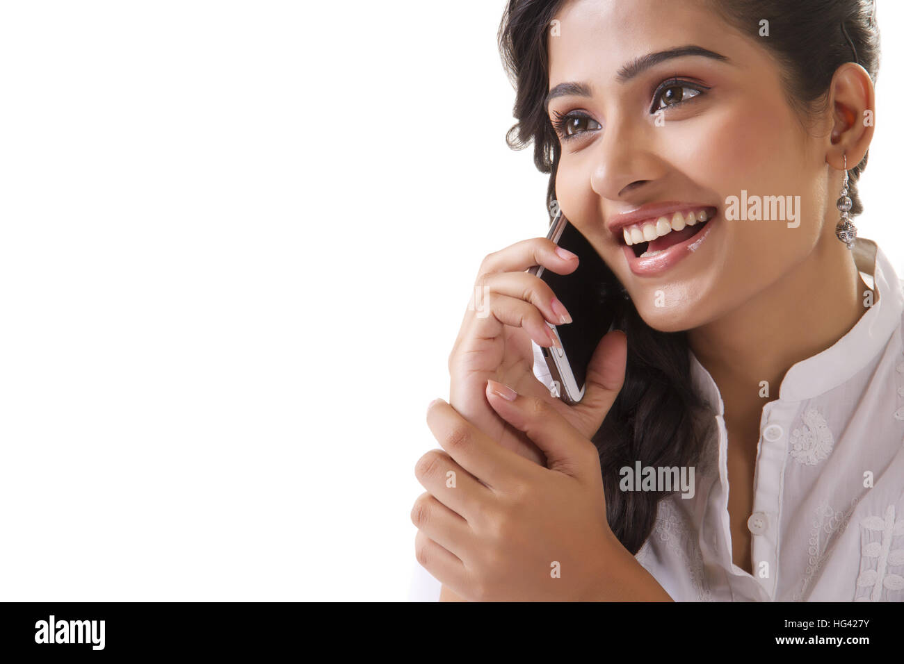 Beautiful young woman talking on mobile phone Stock Photo