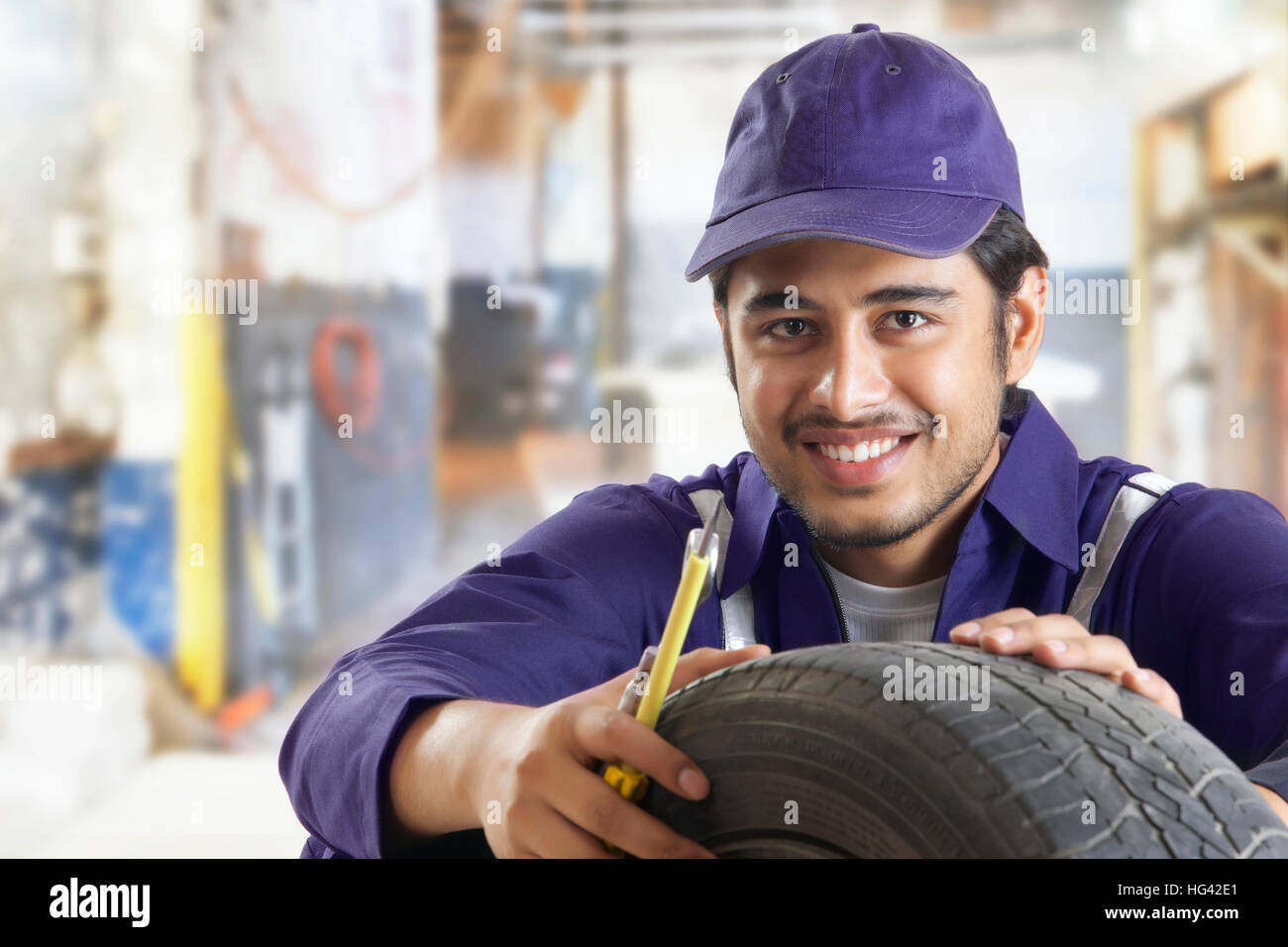 Portrait of car mechanic in repair garage Stock Photo Alamy