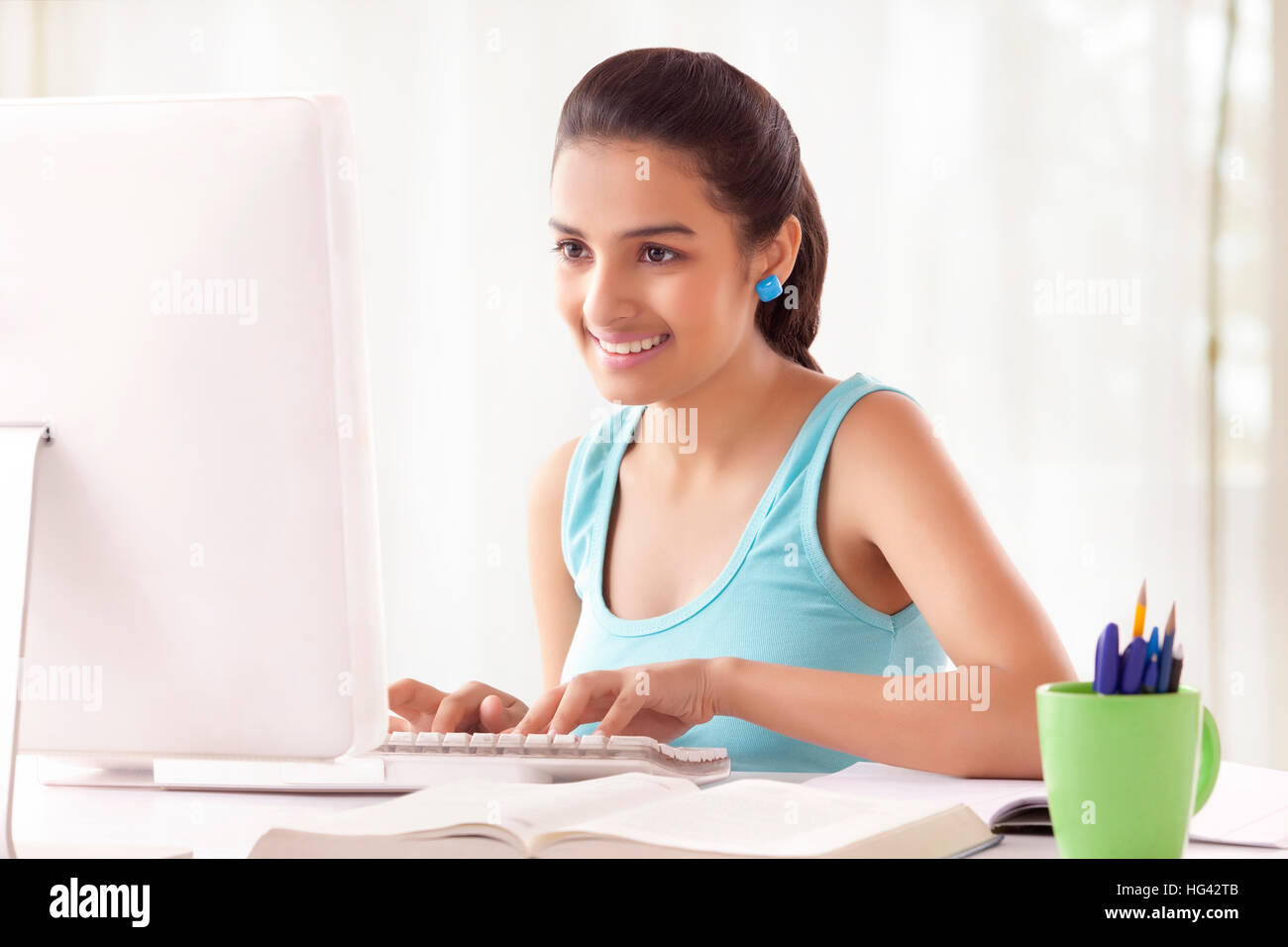 Teenage Girls using computer at home Stock Photo - Alamy