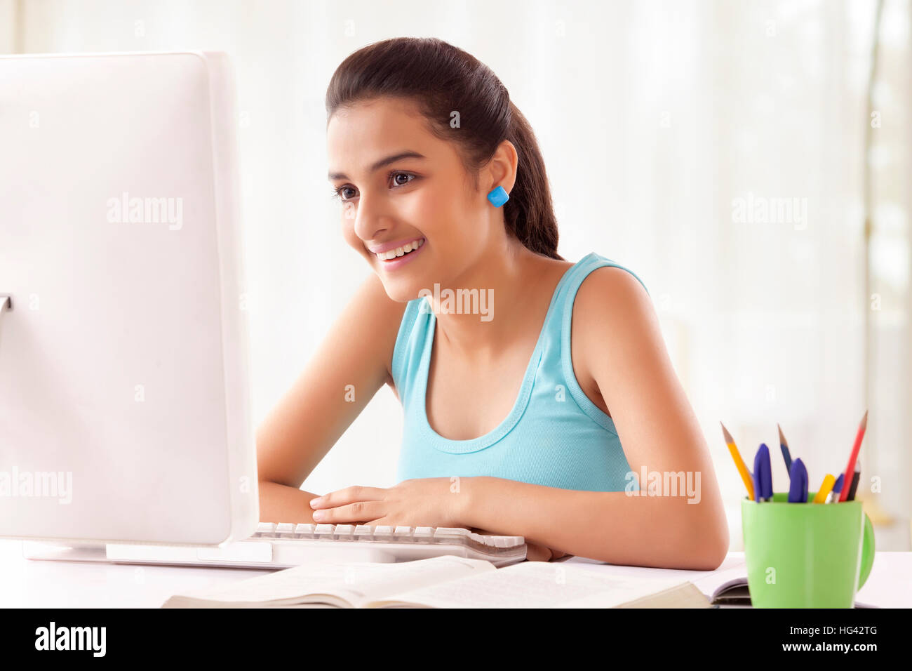 Teenage Girls using computer at home Stock Photo - Alamy