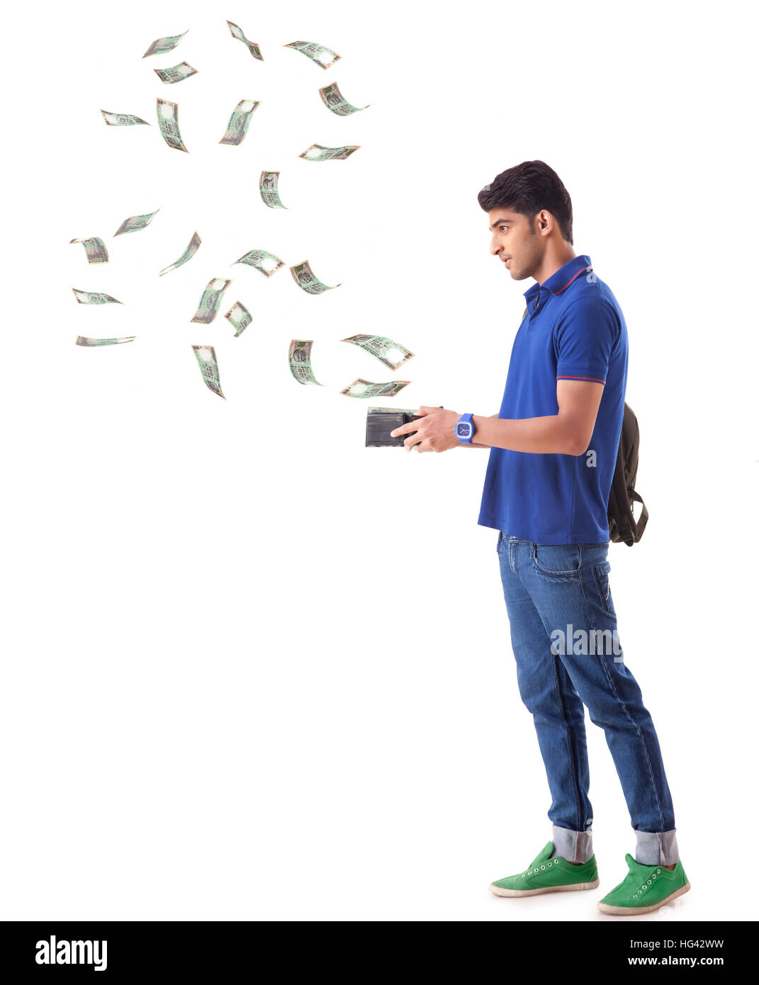 man with money flying out of his wallet Stock Photo