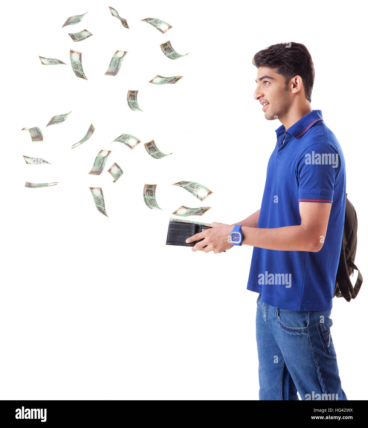 man with money flying out of his wallet Stock Photo