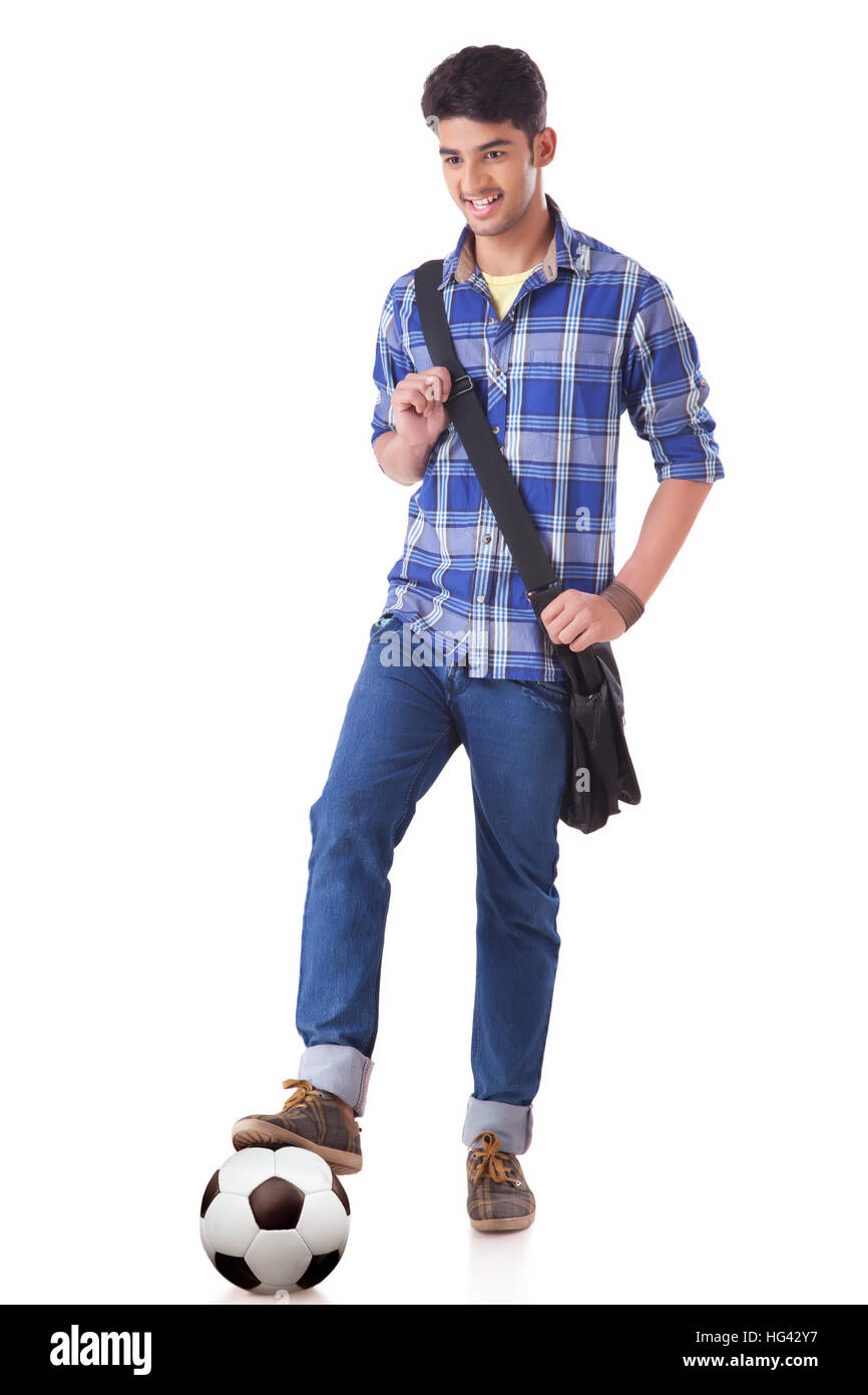 One Leg Student Portrait of smiling young student standing with his one foot on a ...