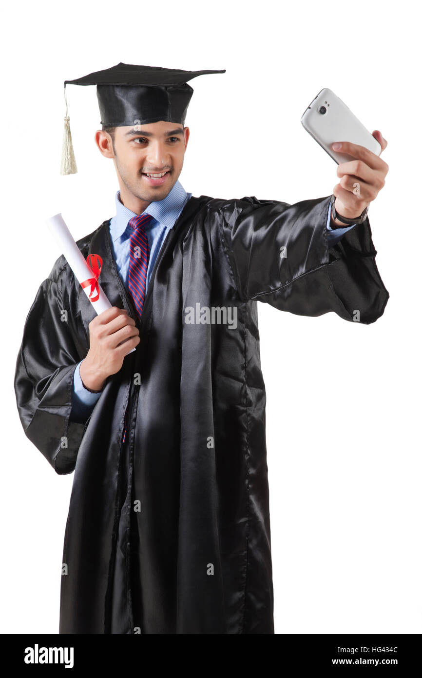 Portrait Of University Graduate Using Mobile Stock Photo - Alamy