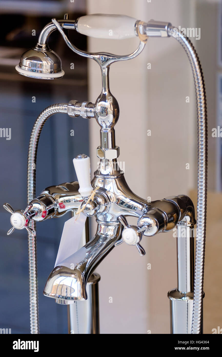 Mixer tap and shower head in chrome Stock Photo