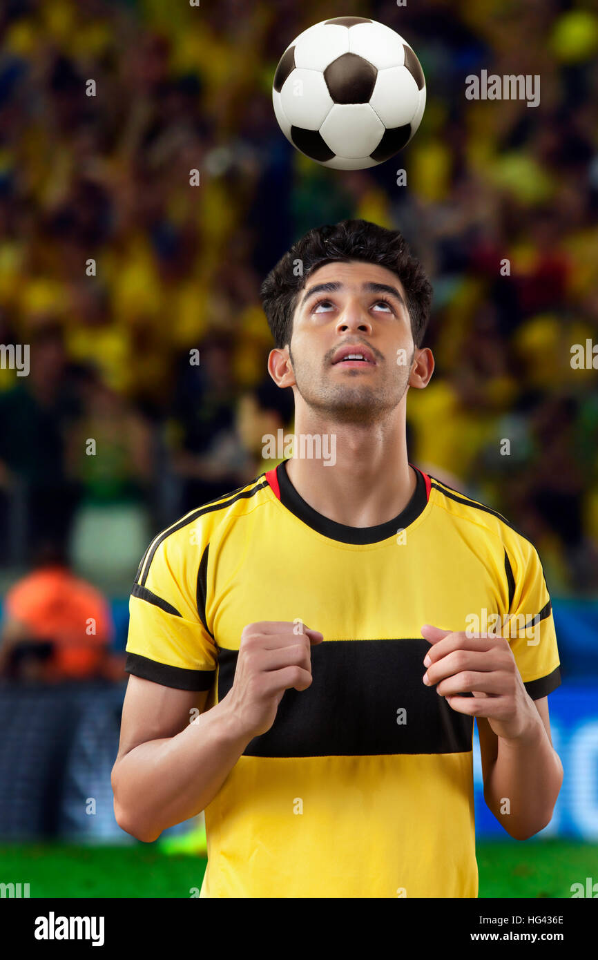 Football player practicing soccer header Stock Photo Alamy