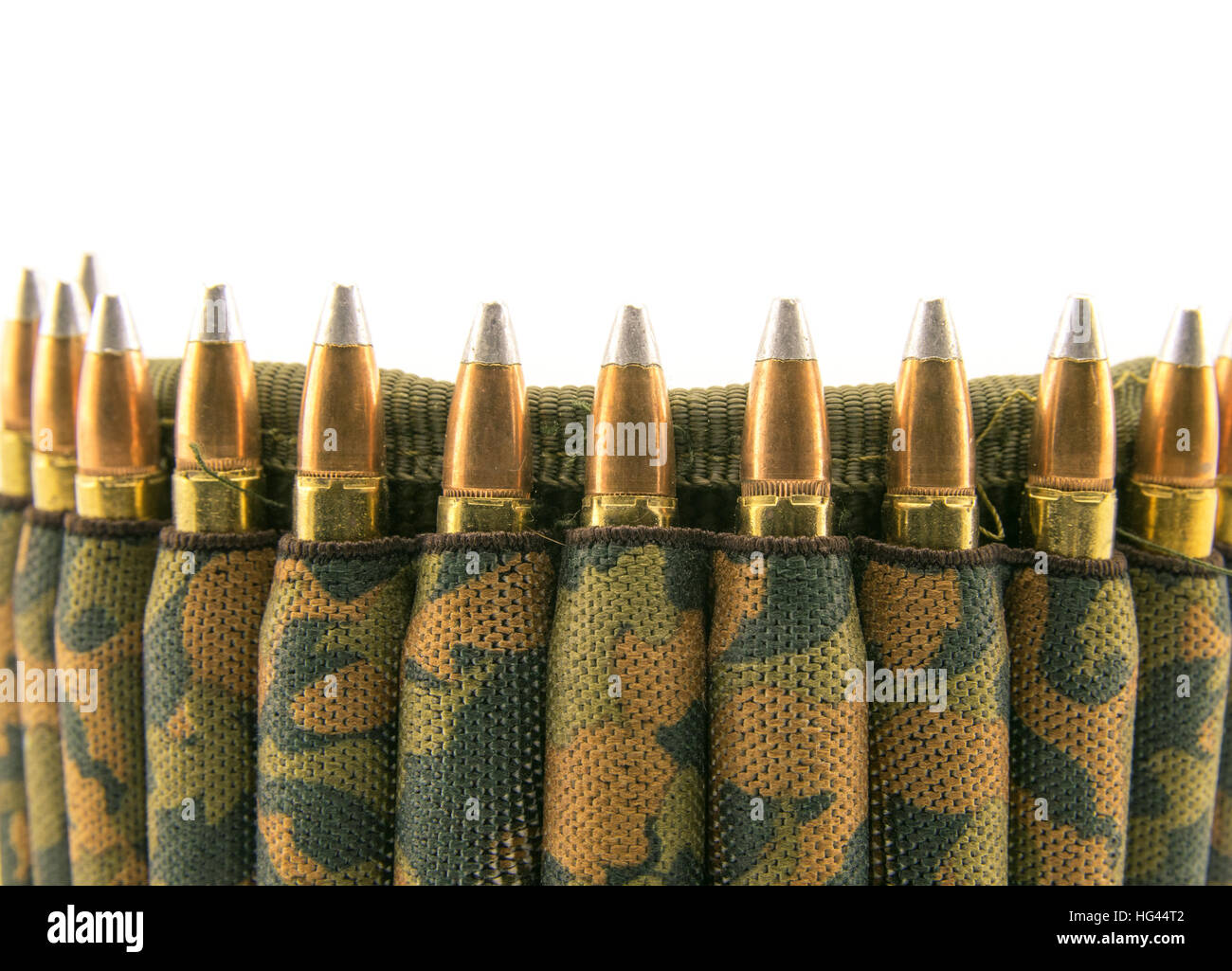 Camouflage ammunition belt for rifle on white background. Stock Photo