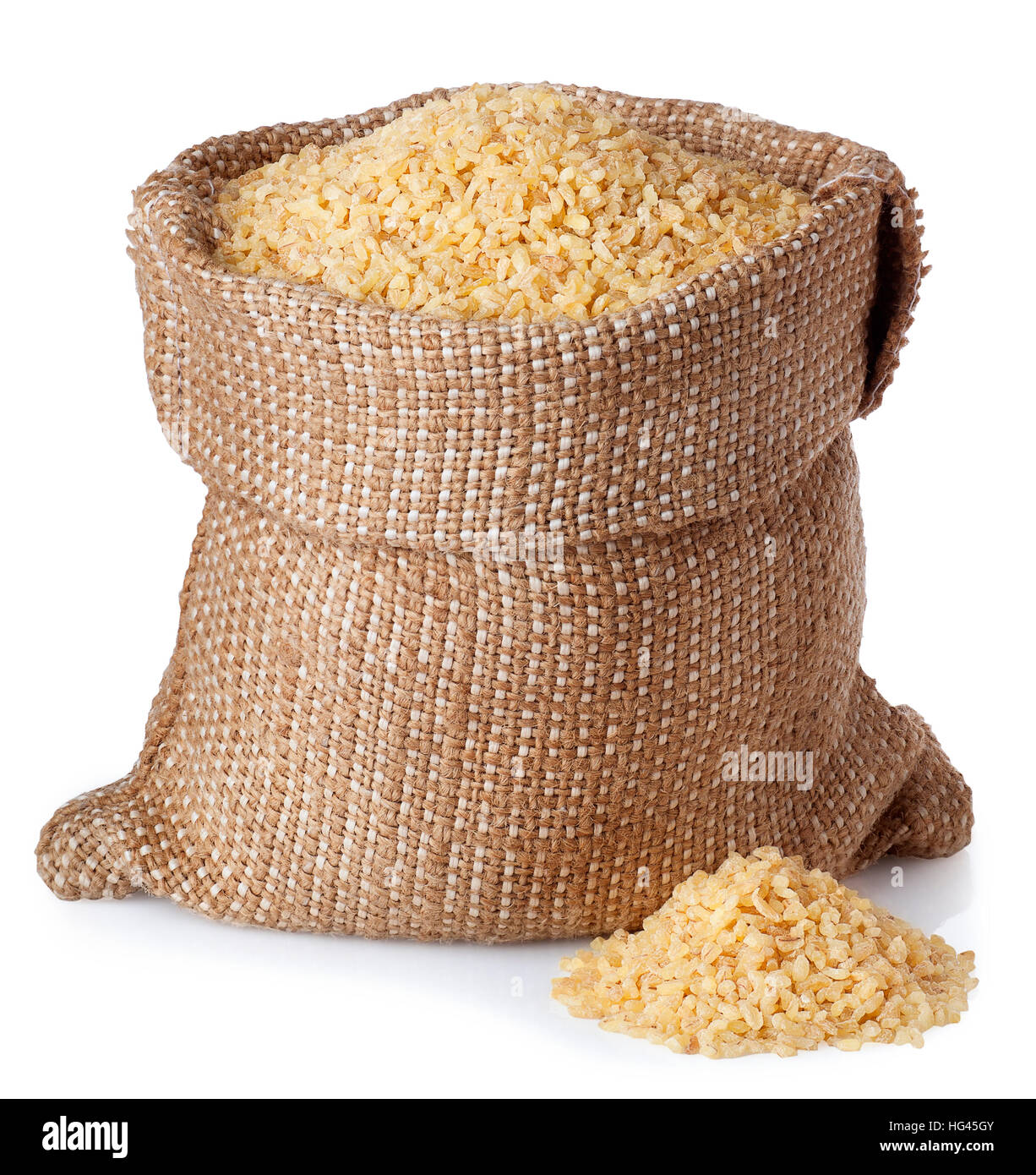 Bulghur or couscous in burlap bag with scattered heap isolated on white background Stock Photo