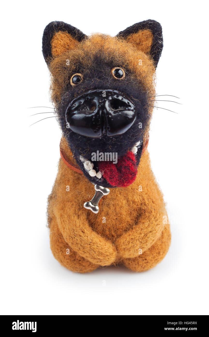 small funny handmade toy ginger dog from felt isolated on white