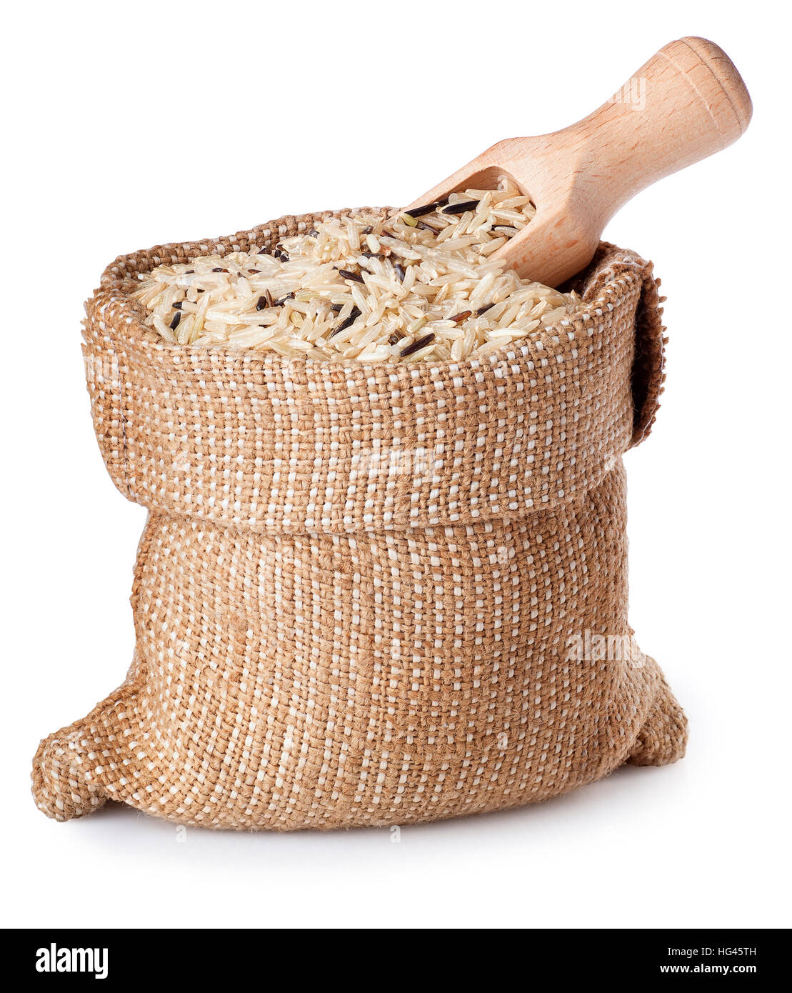 wild brown rice in bag with wooden scoop isolated on white background ...