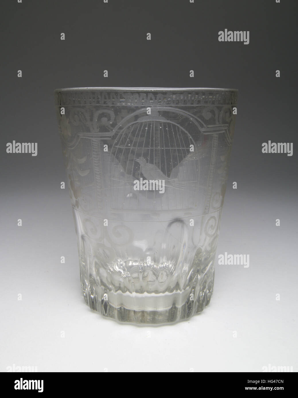 Antique 18th/19th century glass tumbler, engraved with three birds sitting  within cages, with flowers and schools between. The base has a broken ponti  Stock Photo - Alamy