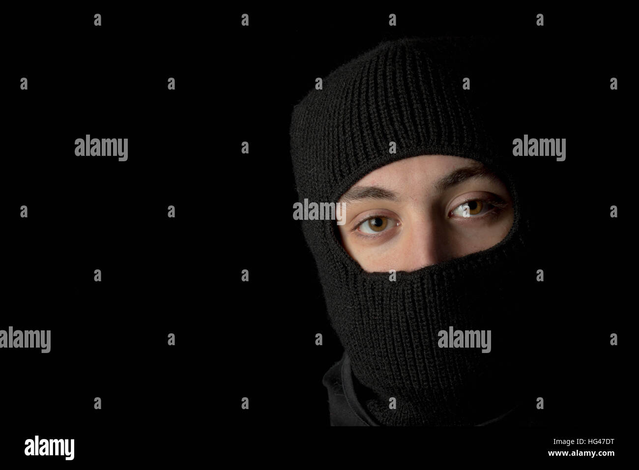 Teen thug with face hidden Stock Photo