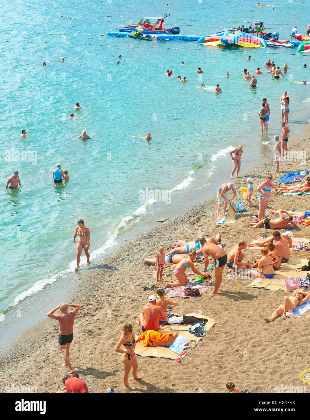 People at a sea beach in Sudak. Crimea, Ukraine Stock Photo