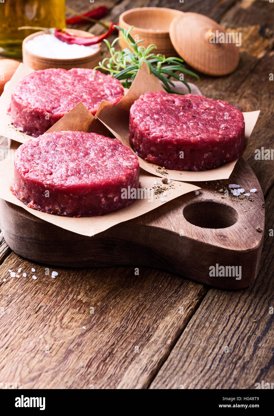 Organic raw ground beef, round patties for making homemade burger on