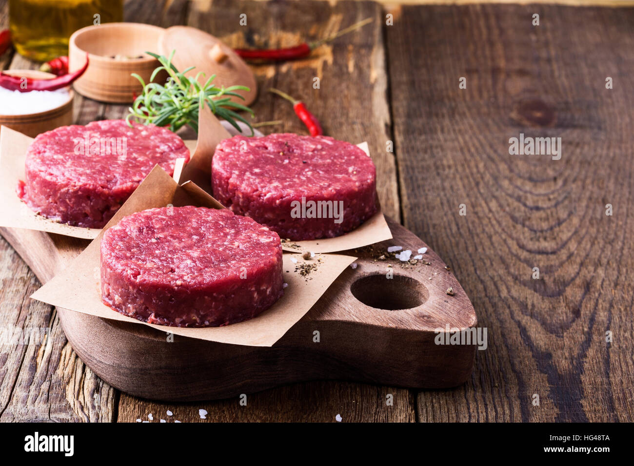 Organic raw ground beef, round patties for making homemade burger on