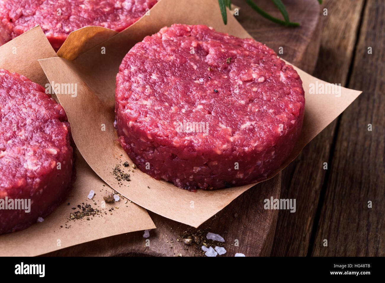 Organic raw ground beef, round patties for making homemade burger on