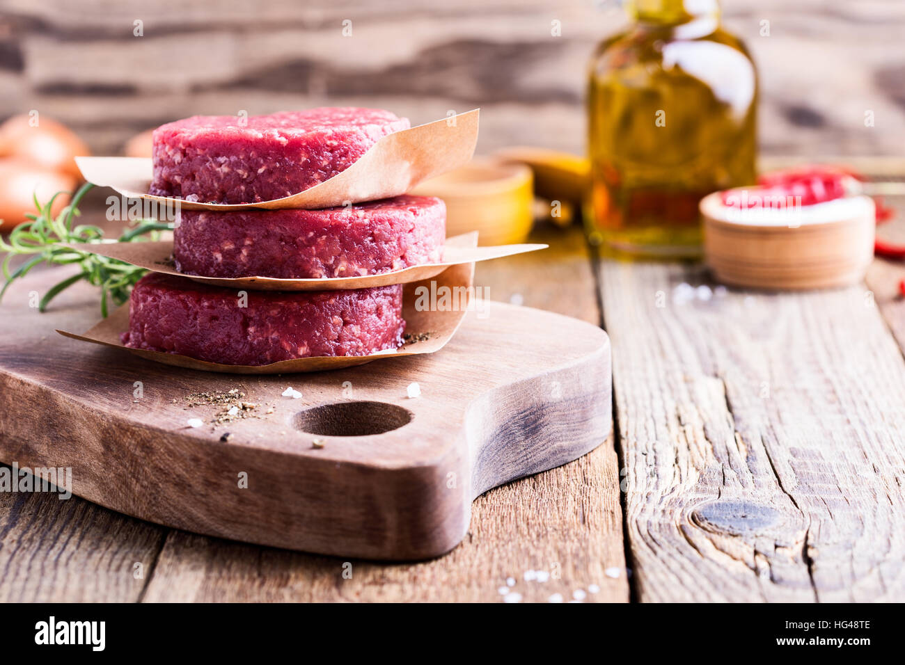 Organic raw ground beef, round patties for making homemade burger on