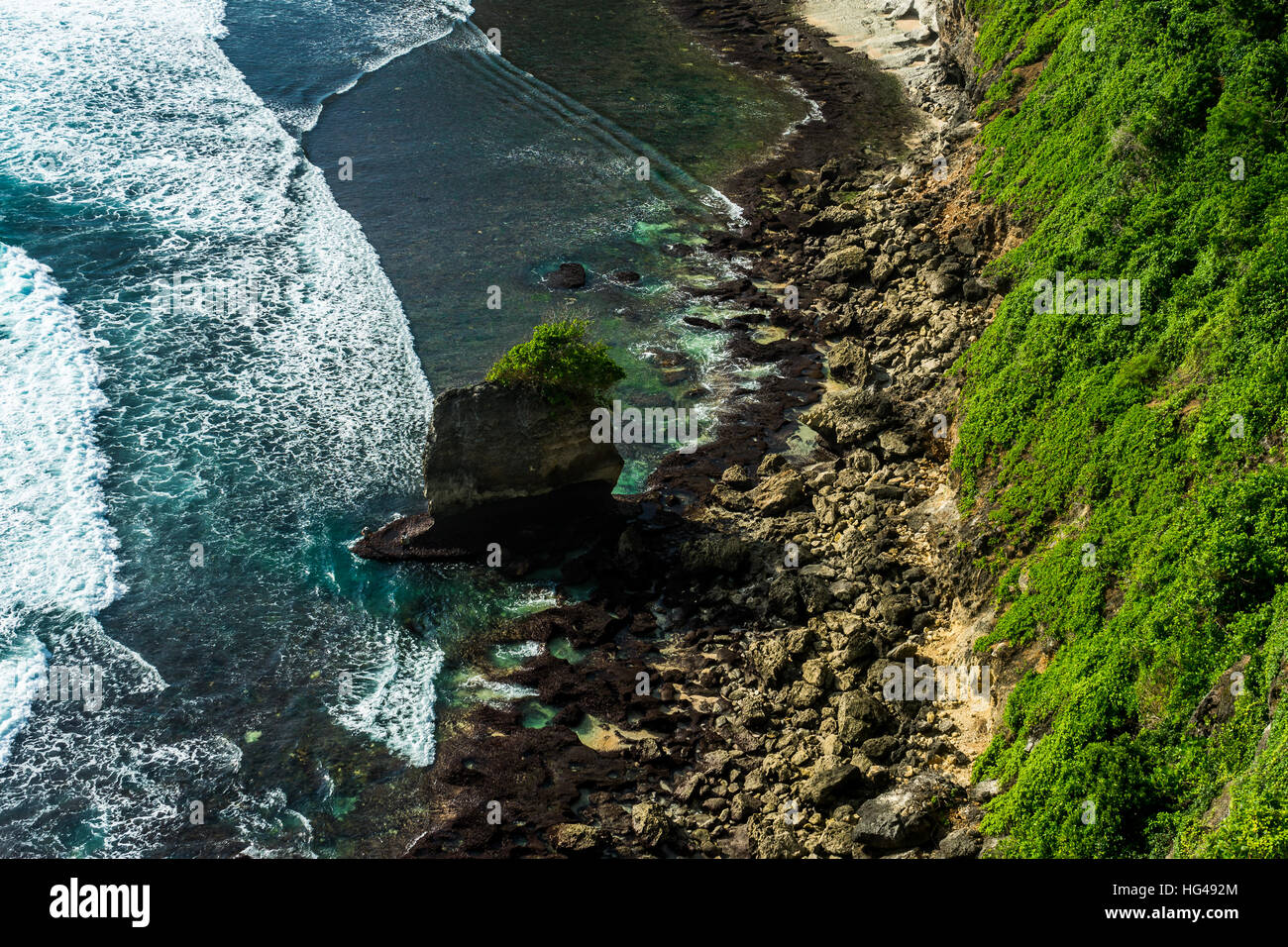 View down to the wild waters on the balinese shores, Uluwatu, Bali, Indonesia. Stock Photo