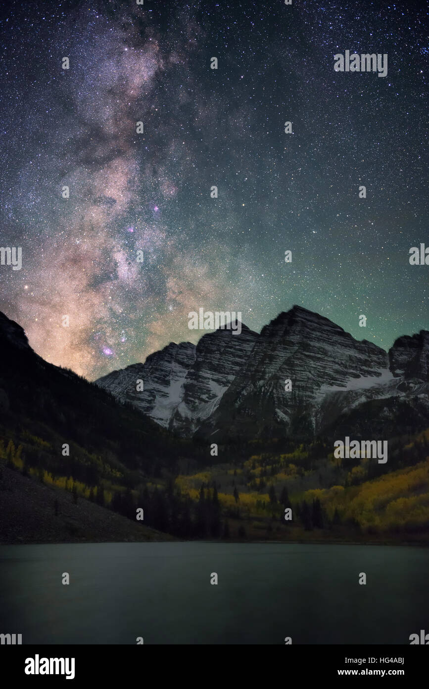 Bright and beautiful milky way over Maroon Bells, Colorado. Amazing reflection of the milky way on Maroon lake during Fall color. Stock Photo