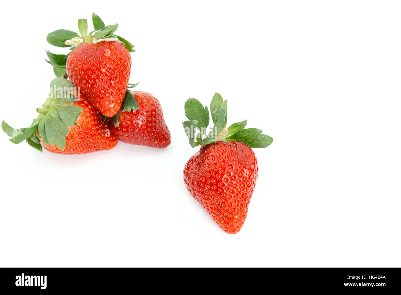 Fresh Strawberries on white background. Piling up and arranging in order. Stock Photo