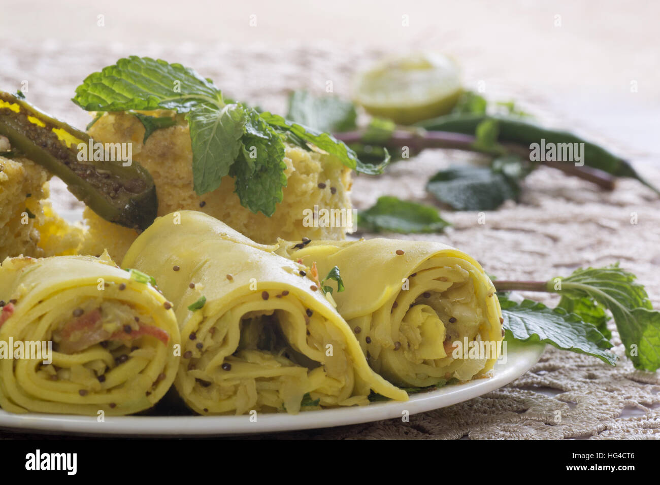 Traditional Gujarati snacks dhokla and cabbage rolls Stock Photo Alamy