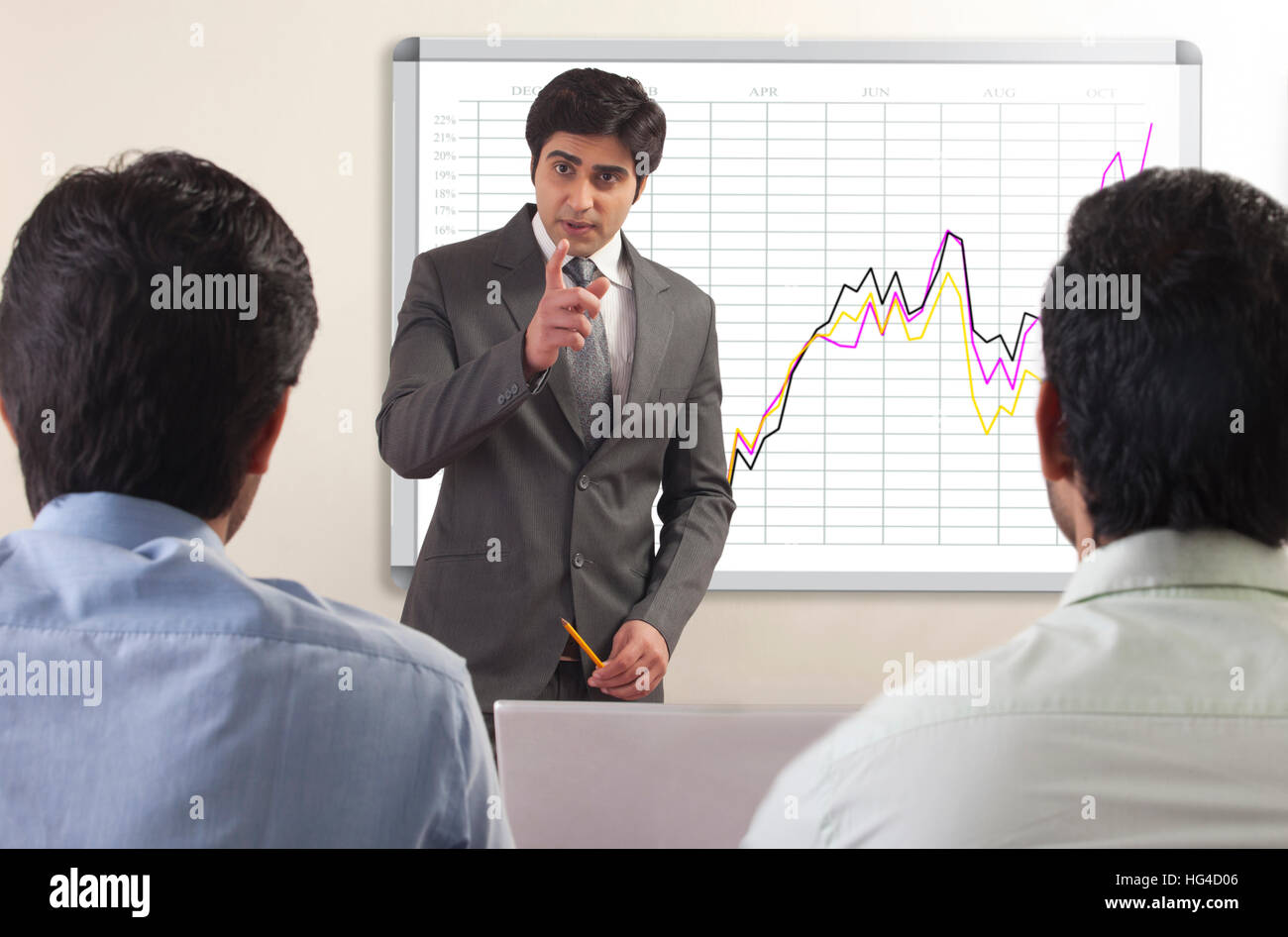 Businessman presenting to colleagues Stock Photo