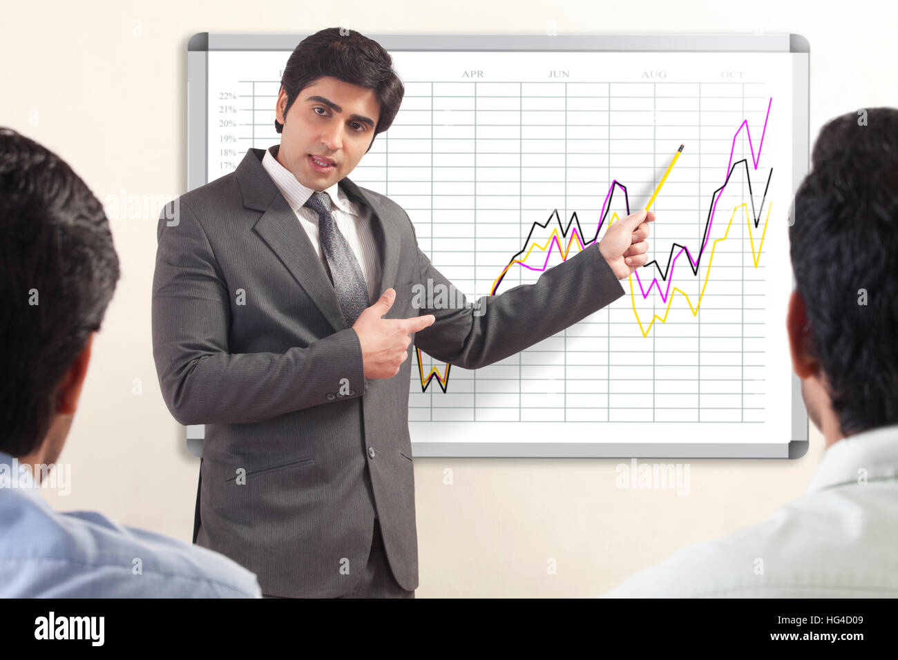 Businessman presenting to colleagues Stock Photo